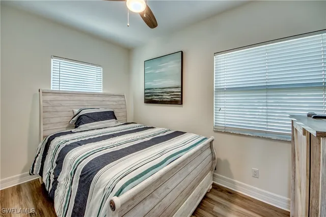 a bedroom with bed and a window