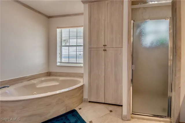 a white bath tub sitting next to a window