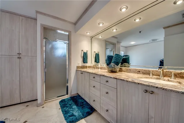 a bathroom with a double vanity sink and a mirror