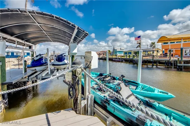 a view of a swimming pool with lawn chairs