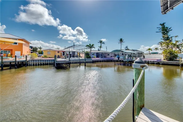 a view of a lake with boats and trees in the background