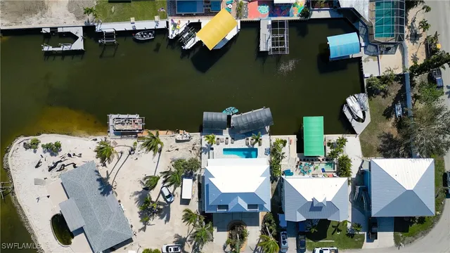 an aerial view of a house with a swimming pool