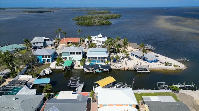 an aerial view of a residential houses with outdoor space