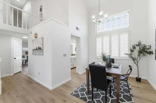 a kitchen with a sink a counter top space stainless steel appliances and cabinets