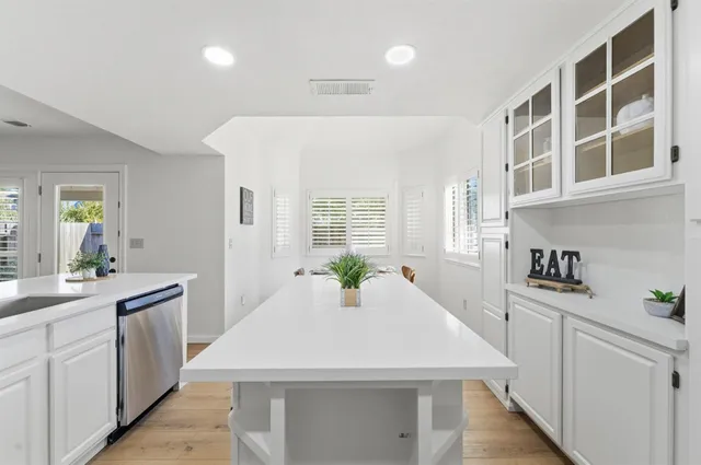 a bedroom with a bed and a lamp