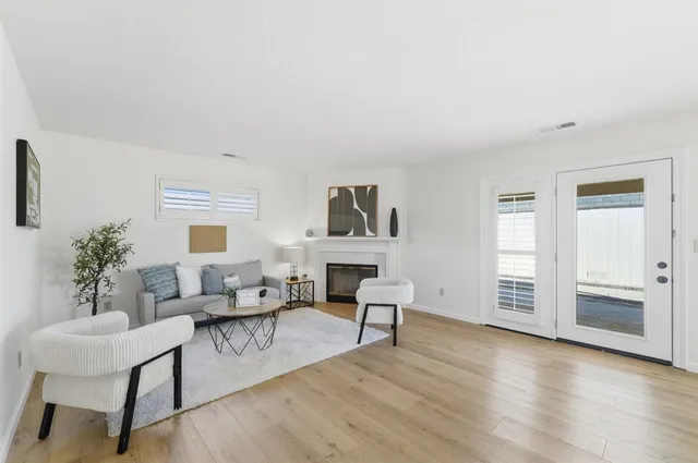 a bedroom with a bed a table and chair