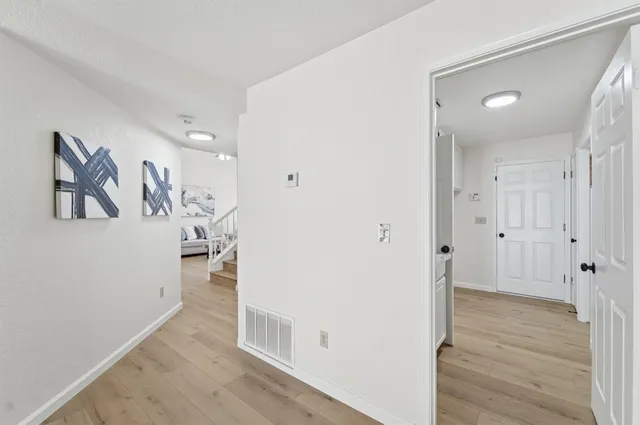 a bathroom with a tub sink and cabinets