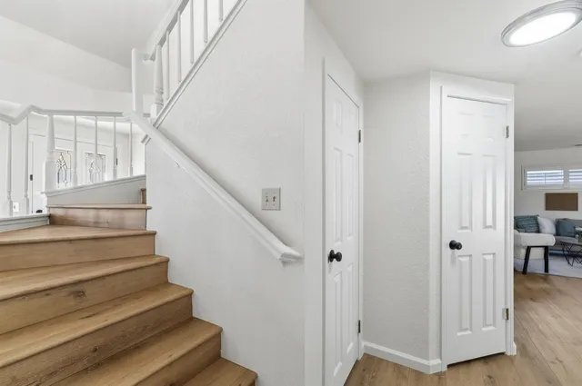 a bedroom with furniture and a wooden floor