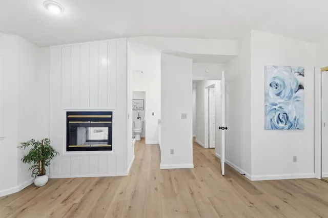 a view of a backyard with wooden fence