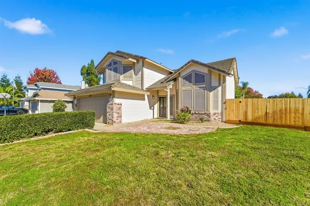 a view of living room filled with furniture and a window