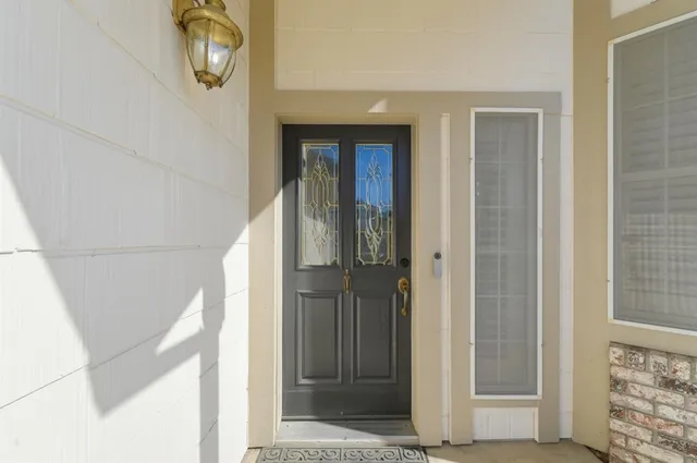 a living room with furniture and windows