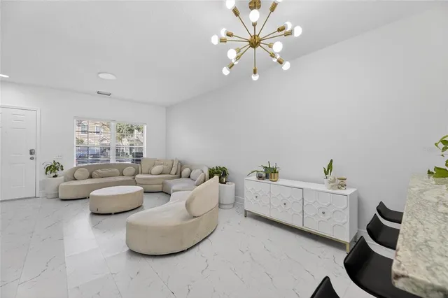 a kitchen with stainless steel appliances a stove a refrigerator and a microwave