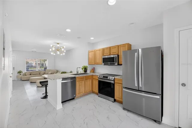 a white toilet sitting next to a white sink