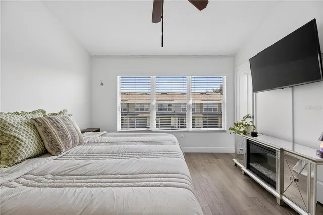 a view of a livingroom with workspace and a window