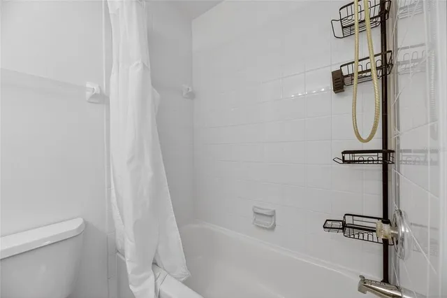 an aerial view of a house with a garden and swimming pool