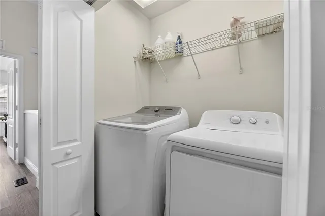 an aerial view of a house with garden space and street view