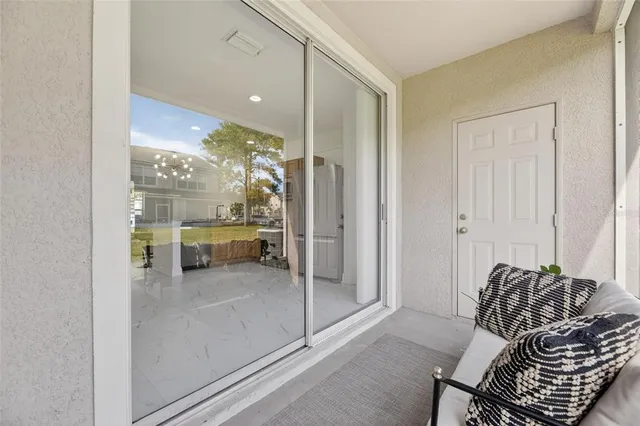 an aerial view of a house with a yard swimming pool and outdoor seating
