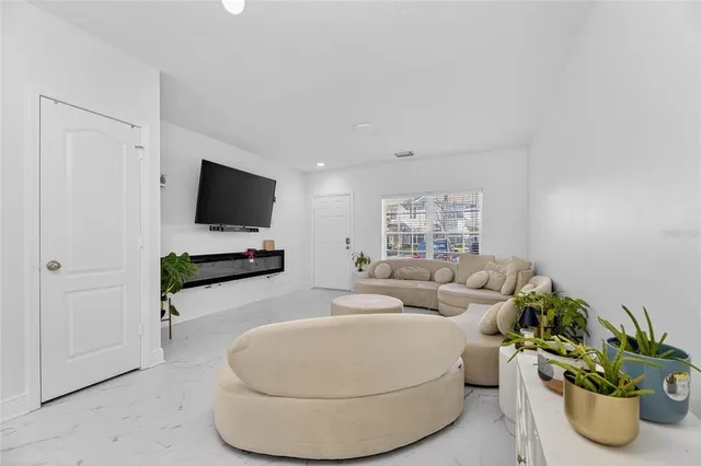 a bedroom with furniture and a wooden floor