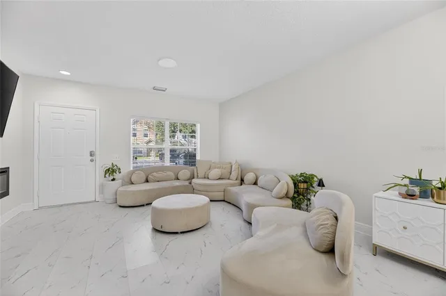 a view of kitchen island with furniture and appliances