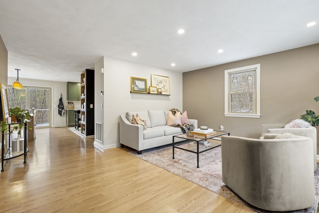 4 Apple Ridge Road, Unit 6 Maynard, MA 01754 - Photo 6 of 40 a living room with furniture and wooden floor