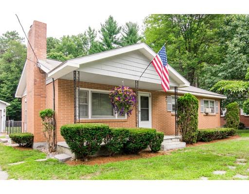 124 Lowell Road Pepperell, MA 01463 - Photo 1 of 27 a front view of a house with a yard