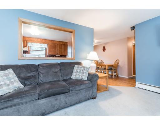 124 Lowell Road Pepperell, MA 01463 - Photo 12 of 27 a living room with furniture and a window