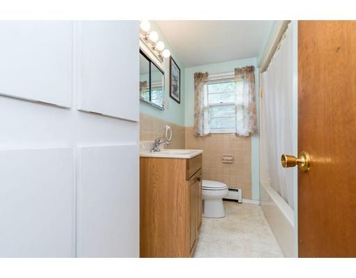 124 Lowell Road Pepperell, MA 01463 - Photo 13 of 27 a bathroom with a sink a toilet and a mirror
