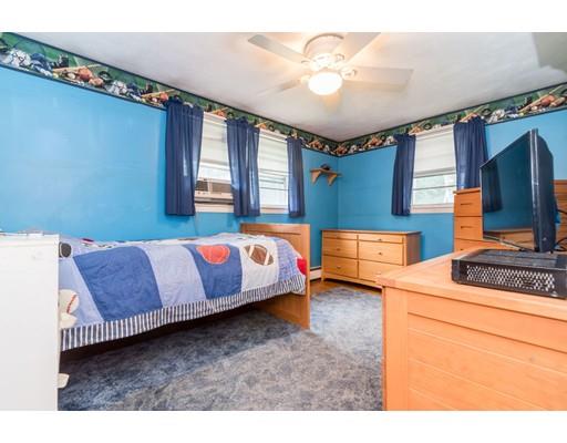 124 Lowell Road Pepperell, MA 01463 - Photo 16 of 27 a bedroom with a bed dresser and a window