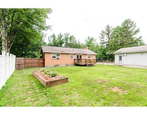 124 Lowell Road Pepperell, MA 01463 - Photo 2 of 27 a house view with a garden space