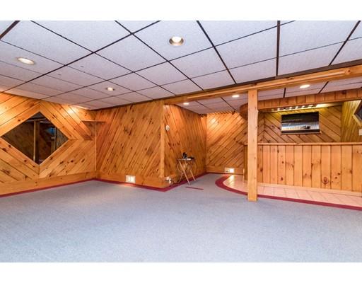 124 Lowell Road Pepperell, MA 01463 - Photo 22 of 27 a view of an empty room with a fireplace