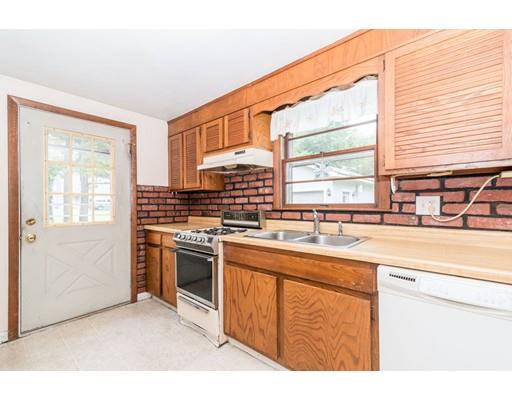 124 Lowell Road Pepperell, MA 01463 - Photo 3 of 27 a kitchen with stainless steel appliances granite countertop a sink a stove and a refrigerator