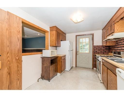 124 Lowell Road Pepperell, MA 01463 - Photo 4 of 27 a kitchen with a refrigerator sink and stove top oven