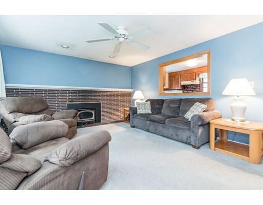 124 Lowell Road Pepperell, MA 01463 - Photo 9 of 27 a living room with furniture and a fireplace