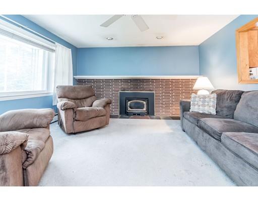 124 Lowell Road Pepperell, MA 01463 - Photo 10 of 27 a living room with furniture and a fireplace