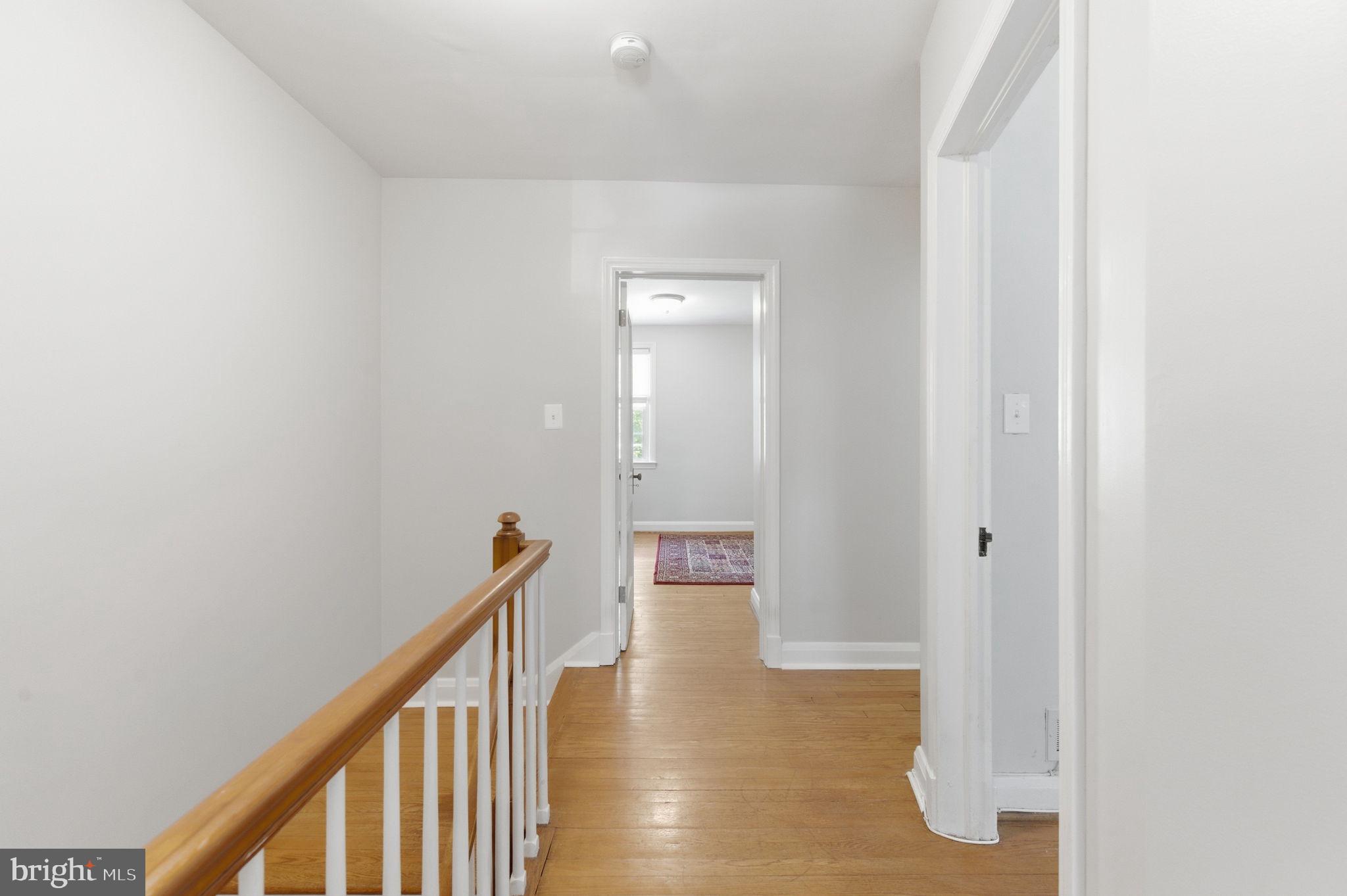 6467 Blenheim Road Baltimore, MD 21212 - Photo 17 of 61 Hallway- hardwood flooring continues