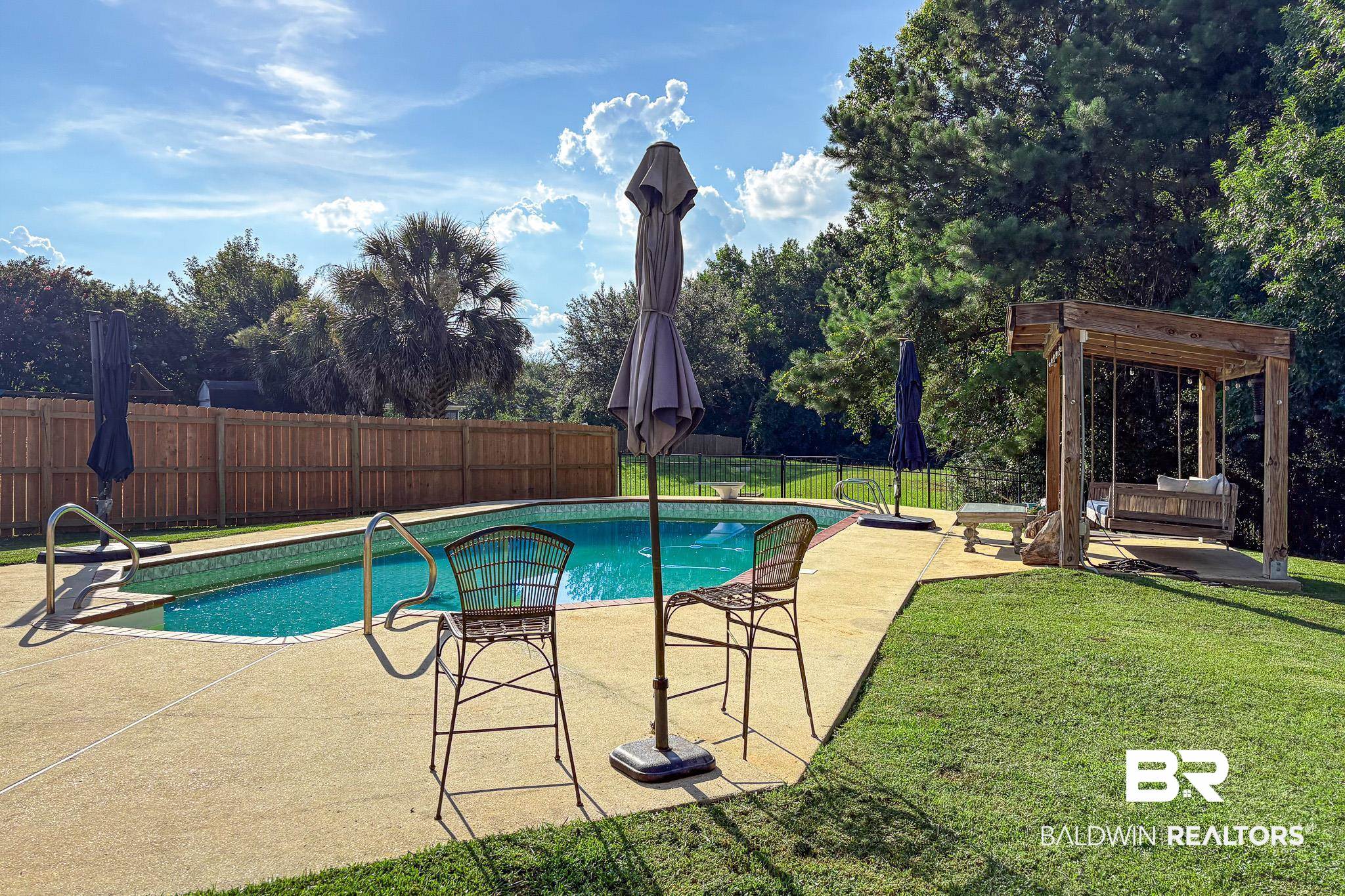 8421 Weatherford Court Daphne, AL 36527 - Photo 32 of 36 View of swimming pool featuring a fenced backyard, a patio, and view of wooded area