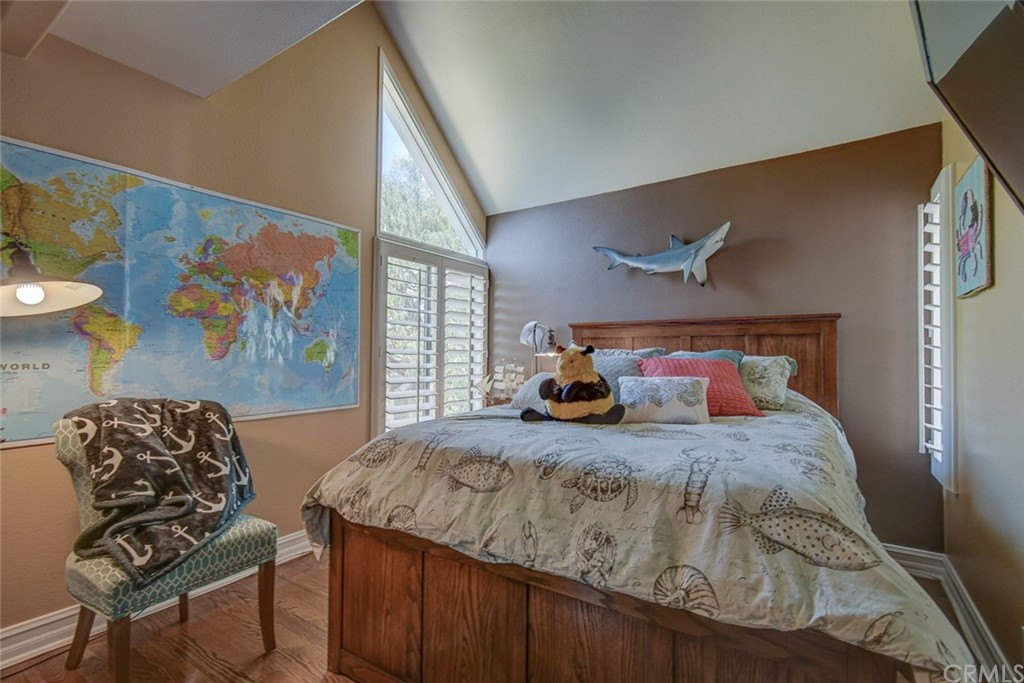 3901 Aruba Circle Huntington Beach, CA 92649 - Photo 27 of 56 a bedroom with a bed and a painting on the wall