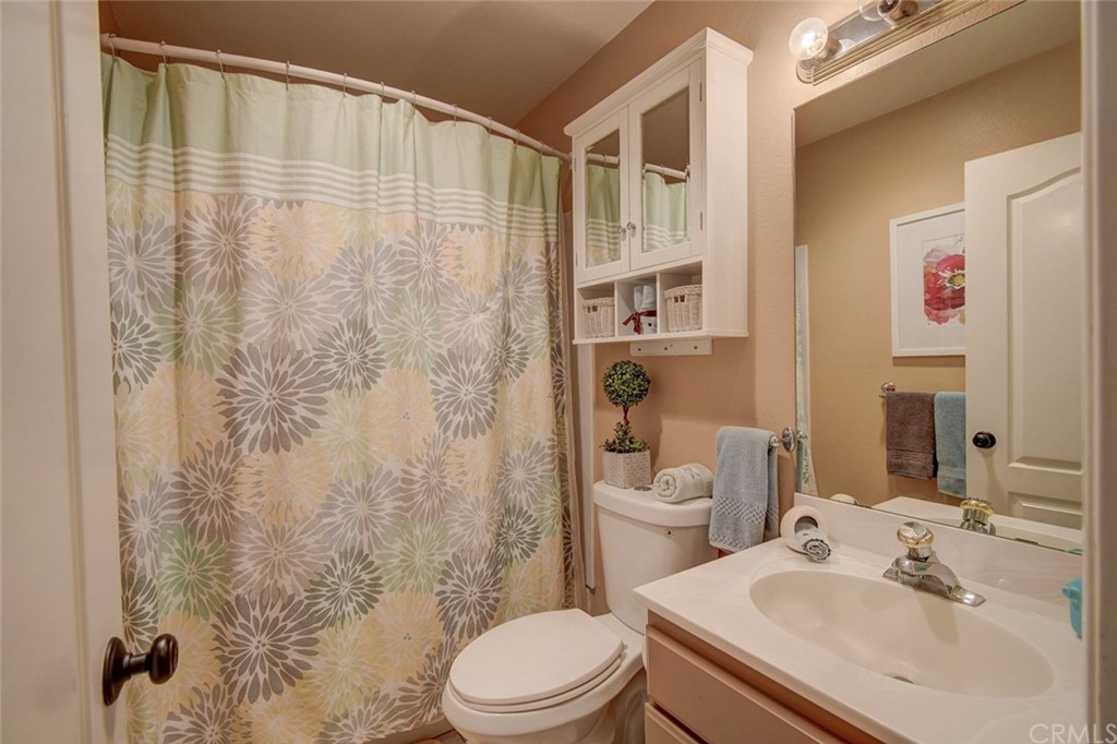 3901 Aruba Circle Huntington Beach, CA 92649 - Photo 29 of 56 a bathroom with a sink toilet and shower