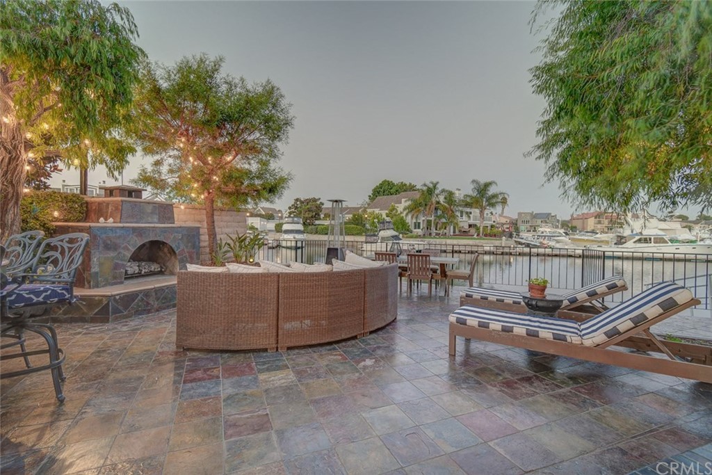 3901 Aruba Circle Huntington Beach, CA 92649 - Photo 3 of 56 a view of a roof deck with couches and potted plants