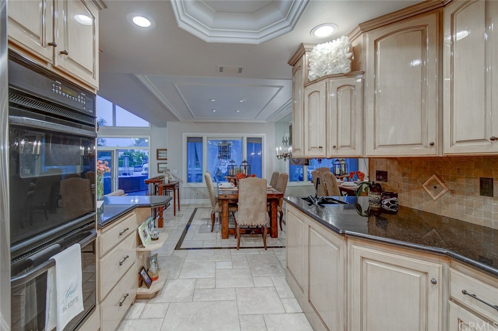 3901 Aruba Circle Huntington Beach, CA 92649 - Photo 32 of 56 a view of a kitchen with appliances and cabinets