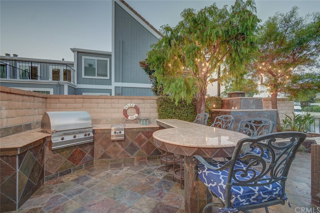 3901 Aruba Circle Huntington Beach, CA 92649 - Photo 36 of 56 a view of a dinning table and chairs in the patio