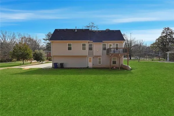 a view of a house with a big yard
