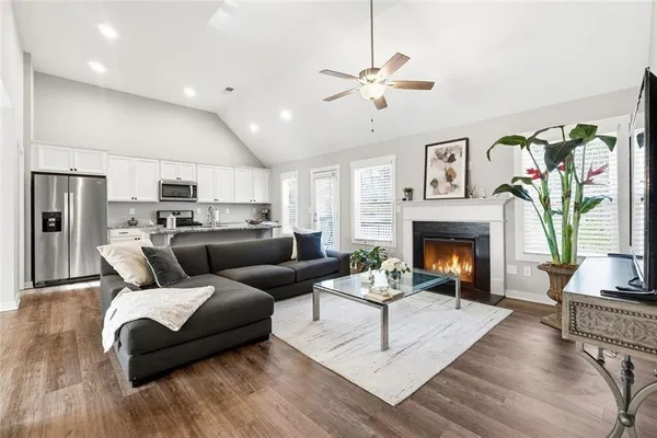a living room with furniture and a fireplace