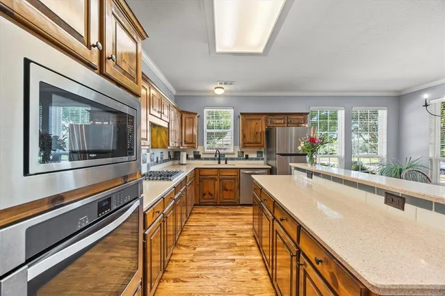 a view of a kitchen with a large window