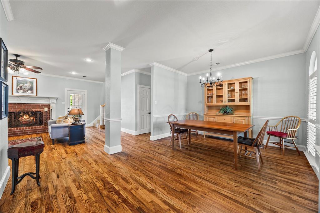 425 Chippendale Drive Heath, TX 75032 - Photo 12 of 37 a living room with furniture and a wooden floor