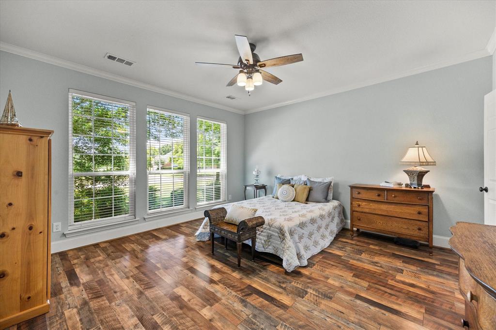 425 Chippendale Drive Heath, TX 75032 - Photo 15 of 37 a bedroom with a bed and window