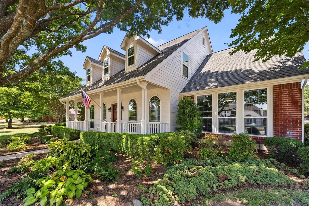 425 Chippendale Drive Heath, TX 75032 - Photo 29 of 37 a front view of a house with garden