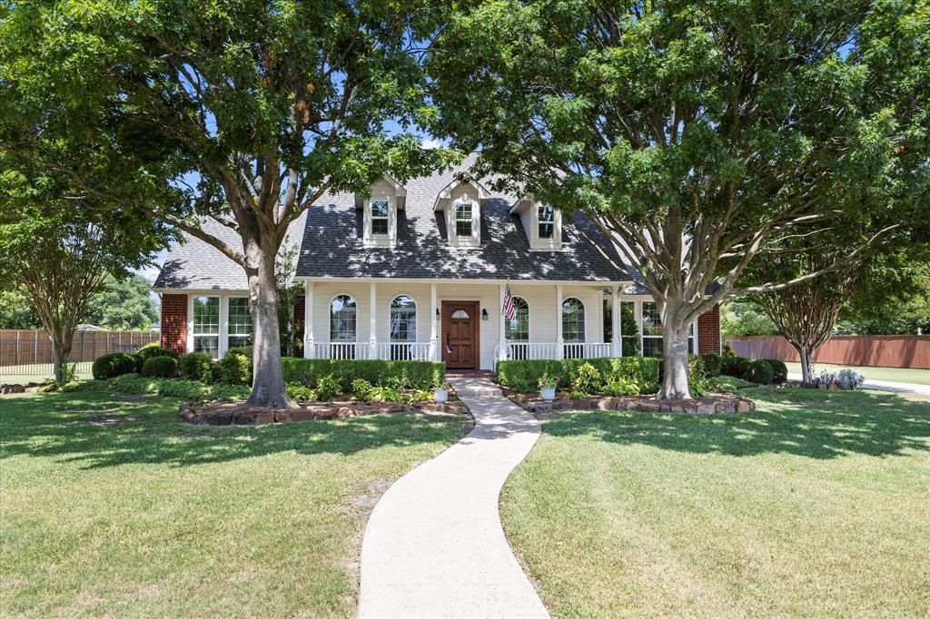 425 Chippendale Drive Heath, TX 75032 - Photo 30 of 37 a front view of a house with a yard