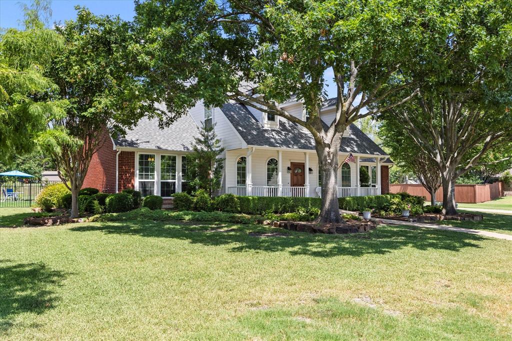 425 Chippendale Drive Heath, TX 75032 - Photo 32 of 37 a front view of a house with a yard