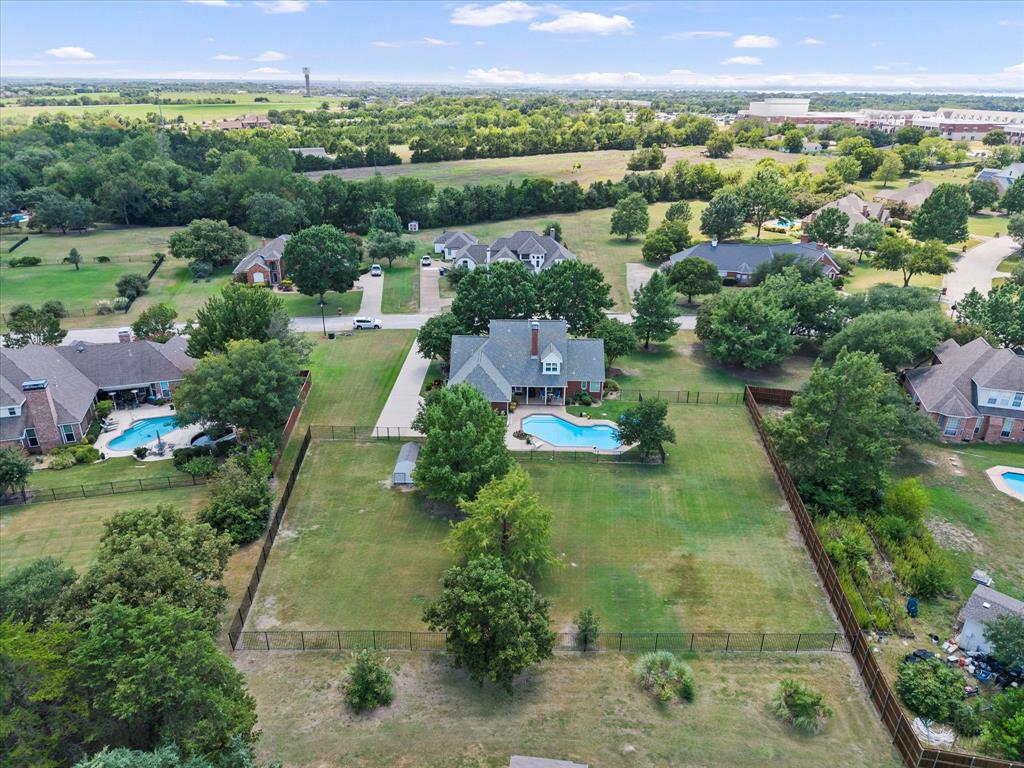 425 Chippendale Drive Heath, TX 75032 - Photo 34 of 37 an aerial view of residential houses with outdoor space and street view